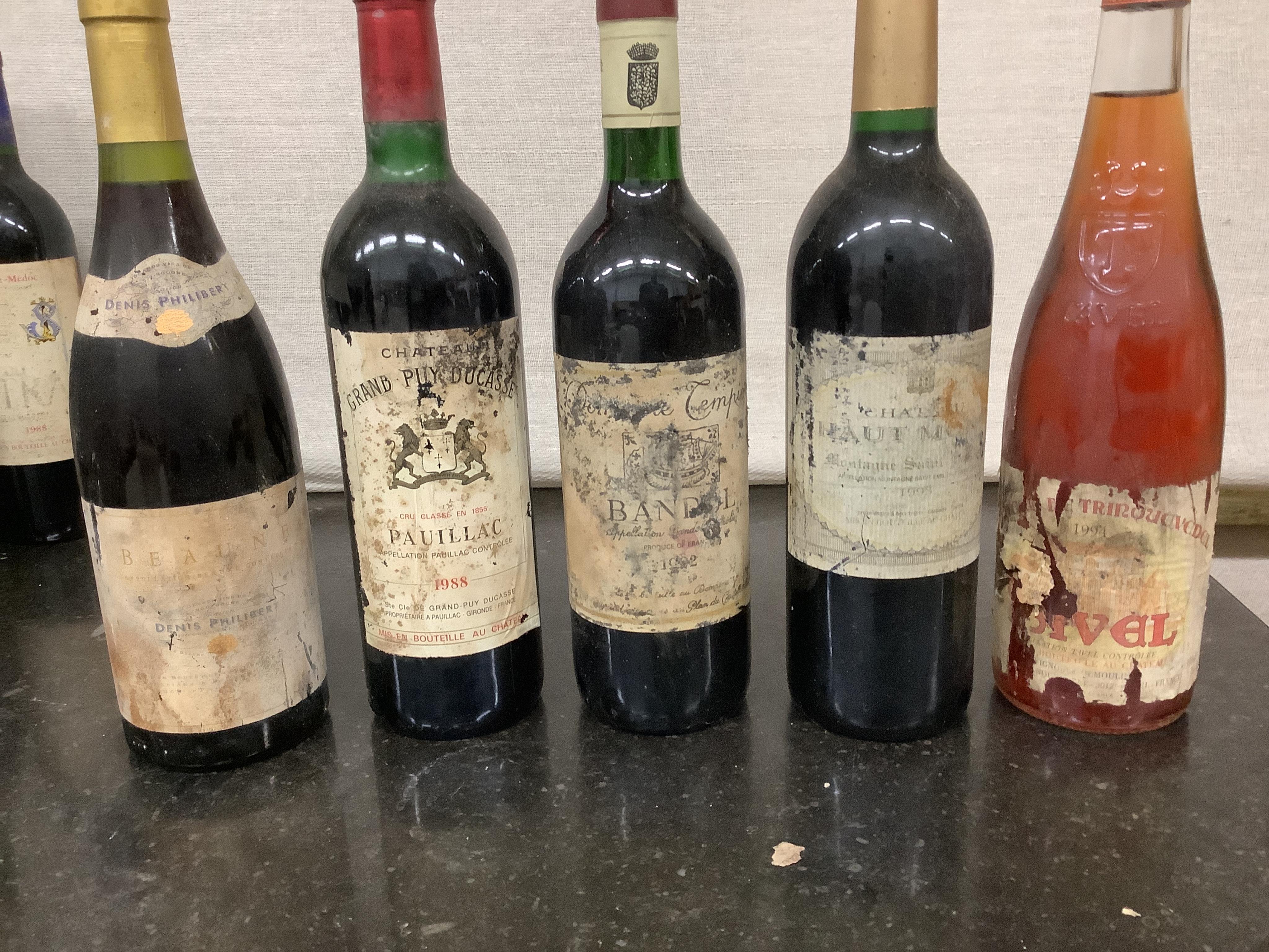 Forty one assorted bottles of wine. Condition - fair, many labels degraded, from a local private cellar)